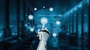 Robotik bir el, insanları temsil eden dijital bir ağ ile etkileşime girer ve modern bir çalışma alanı ortamında teknolojinin ve bağlantının kaynaşmasını resmeder. Auvana