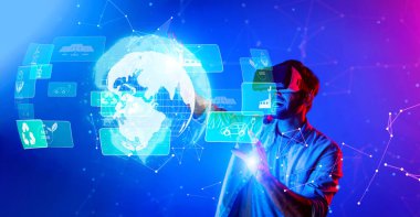 Bir insan, sürdürülebilir çözümleri keşfetmek, Dünya Günü 'nde çevresel farkındalık ve yenilikçi teknoloji göstermek için sanal gerçeklikle meşgul olur. XDMCP