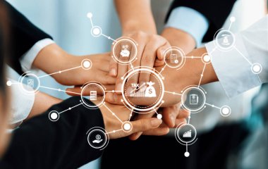 Finansal bağlamda takım çalışması ve ortaklığı temsil eden dinamik bir resim, çeşitli endüstriler içindeki işbirliği ve birbirine bağlılığı vurguluyor. Dostluk