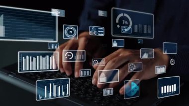 Modern teknoloji ve veri analizinin özünü somutlaştıran çeşitli dijital grafikler ve veri görselleştirmeleriyle çevrili bir dizüstü bilgisayarda yazı yazan ellerin yakın çekim görüntüsü. Xenic