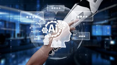 İnsan elinin robot kola uzanan çarpıcı görüntüsü, gelecekteki dijital çalışma alanında teknoloji ve insan yaratıcılığı arasındaki işbirliğini sembolize ediyor. Auvana