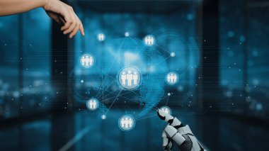 İnsan elinin büyüleyici bir görüntüsü ve dijital ağa doğru uzanan robotik bir el modern çalışma alanındaki insan yaratıcılığının ve gelişmiş teknolojinin birleşimini sembolize ediyor. Auvana