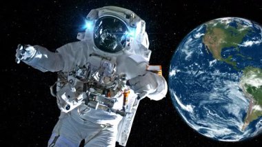 Astronot uzay yürüyüşü yaparken uzay istasyonunda uzay uçuşları yapıyor. Astronot operasyon için tam uzay kıyafeti giyiyor. Bu görüntünün elementleri NASA astronot fotoğraflarıyla donatılmıştır. .