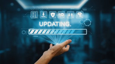 Gösterişli bir ofis arka planına karşı hazırlanan çeşitli grafik simgeleriyle birlikte, güncelleme durumunu gösteren sanal bir ilerleme çubuğuna uzanan bir el. Auvana