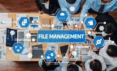 Bu resim, işbirlikçi bir iş ortamı içinde modern dosya yönetimi uygulamalarını, geliştirilmiş organizasyon ve verimlilik için araçları ve stratejileri göstermektedir. Dostluk