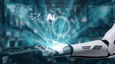 Gösterişli bir robot el, yenilik ve teknolojiyi vurgulayarak, gelecekteki dijital çalışma alanında canlı holografik sembollerle yapay zeka kavramını sergiliyor. Auvana