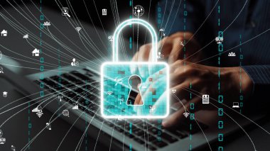 Bilgisayar klavyesinde veri korumasını sembolize eden kilitli bir asma kilidi gösteren dijital güvenliğin kavramsal görüntüsü, teknolojide siber güvenlik ve mahremiyeti temsil ediyor. Xenic