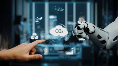 Bir insan eli robotik bir kol ile fütüristik bir ortamda etkileşime girer ve karbondioksit azaltımı ve sürdürülebilirlik stratejileri üzerine odaklanmış dijital grafikler gösterir. Auvana