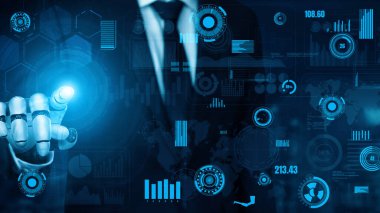 Takım elbiseli bir işadamı, veri görselleştirmeleri ile etkileşim içinde olmak için ileri teknolojiyi kullanır, dijital dönüşümü ve iş yönetiminde yenilikçi stratejileri sembolize eder. Xenic