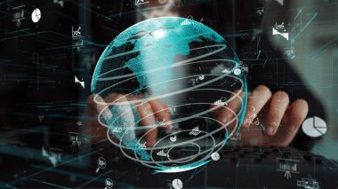 Dijital bir küre, veri görselleştirme elementleriyle geliştirilmiş küresel bağlantıyı resmeder. Bu modern iş sahnesi teknoloji ve analitiğin önemini vurguluyor. Xenic