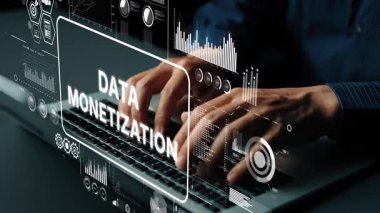 Data monetization concept with hands typing on a keyboard and digital analytics graphics overlay for business growth strategies. Asymptotic smart data analytic.