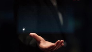 A modern hand presents a digital graph illustrating upward business trends, emphasizing data analytics and financial growth in a professional setting. Copula