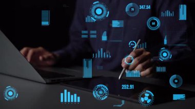 A close-up view of a user interacting with a laptop and tablet, surrounded by dynamic data visualizations, illustrating the modernization of analytics in today workspace. Xenic