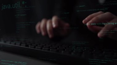 Close-up shot of hands typing on a keyboard with floating lines of code in a dark space, symbolizing the essence of programming and software development in modern technology. Xenic