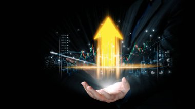 Finansal büyümenin, yükselen bir ok ve borsa grafiklerini tutarak yatırım başarısı ve fırsat potansiyelini gösteren görsel bir temsili. Dörtgen