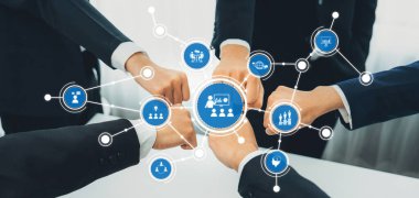 This image showcases a dynamic representation of teamwork and collaboration, highlighting multiple hands joining together in a business context, symbolizing unity and innovation. Amity