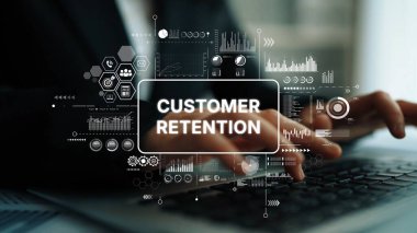 Hands typing on a laptop with customer retention concept illustrated through digital graphics and data analytics charts. Asymptotic smart data analytic.