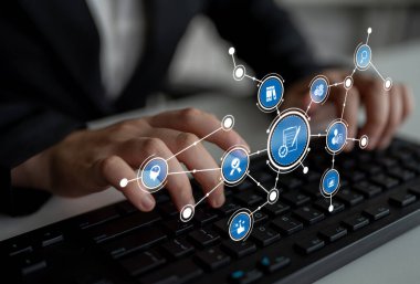 Close-up view of hands typing on a keyboard with an overlay of digital marketing icons, illustrating the connection between online shopping, business strategies, and technology. Tessel