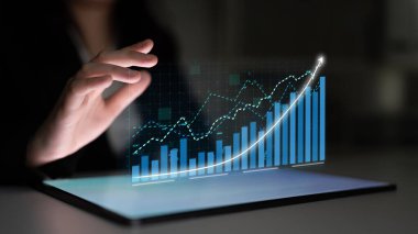 A business professional interacts with a futuristic screen, analyzing financial data with dynamic charts and graphs to support strategic decision-making and growth. Impute