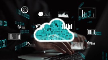 A modern scene featuring hands typing on a laptop with digital charts and cloud computing graphics surrounding them, emphasizing technology and data analysis in a fresh workspace. Xenic