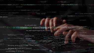 A close-up view of hands typing on a keyboard with blurred lines of code in the background, showcasing the essence of programming and technology in a modern workspace. Xenic