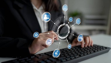 Professional woman typing on a keyboard in a modern office, surrounded by digital icons symbolizing technology, data analysis, and connectivity in the workplace. Crux