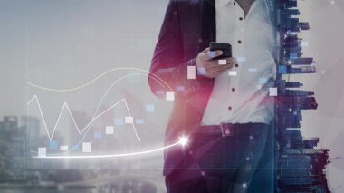 Business professional interacting with smartphone, set against a blend of financial data visuals and city environment, symbolizing modern success and growth in finance. Copula