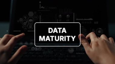 Hands Touching Laptop Screen Displaying Data Maturity Concept with Digital Graphs and Charts for Business Analysis. Asymptotic smart data analytic.