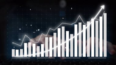 This image depicts a digital screen showcasing a financial growth graph with bars and an upward arrow, symbolizing progress and success in a modern business environment. Copula