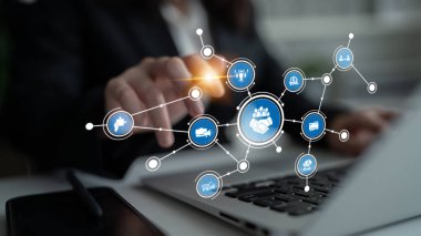 A professional hand interacts with technology, showcasing digital network connections and handshake icons on a laptop, symbolizing business collaboration and partnership. Tessel