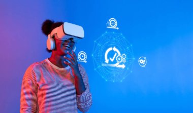 A joyful woman wearing a virtual reality headset engages with agile methodology concepts in a modern digital environment. The blue background enhances the futuristic feel. XDMCP