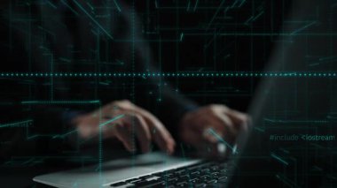 Close-up perspective of hands actively typing on a laptop keyboard against a dark background, highlighting the modern workspace and technology-driven environment. Xenic