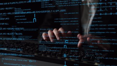 Hands typing on a keyboard with glowing lines of code in a dark environment, symbolizing the world of programming and cyber security innovation, modern technology. Xenic