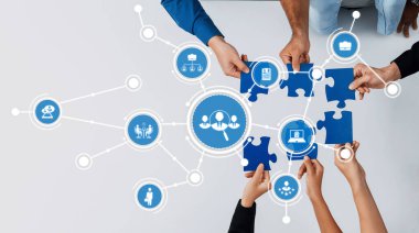A dynamic scene showcasing diverse hands working together to assemble a puzzle, symbolizing teamwork, collaboration, and digital connections in a modern environment. Amity