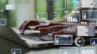 Hands typing on a laptop while surrounded by floating digital graphs and statistics, showcasing the integration of technology and data analysis in a modern workspace. Xenic