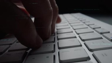 A close-up shot of hands typing on a sleek keyboard, surrounded by abstract code text, symbolizing the world of programming and digital innovation. Xenic