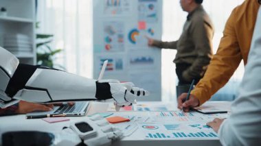 Professionals analyze data with AI tools, collaborating to refine marketing strategies and business solutions in a high-tech, results-oriented workspace. Noogenesis AI