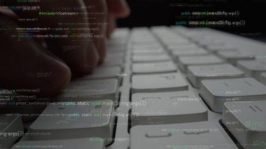 A close-up view of hands actively typing on a sleek keyboard surrounded by floating programming code and digital syntax, emphasizing modern technology and software creation. Xenic