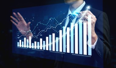 A businessman uses a digital interface to analyze stock market data, showcasing growth through innovative graphs and charts that represent investment trends. Impute