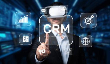 A business professional engages with virtual reality technology, showcasing innovative CRM interfaces aimed at enhancing customer relationship management and data insights. XDMCP