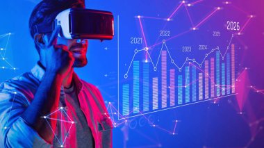 A man engages in immersive virtual reality experience, exploring data trends and statistics within a dynamic, colorful digital environment filled with technology elements. Raster