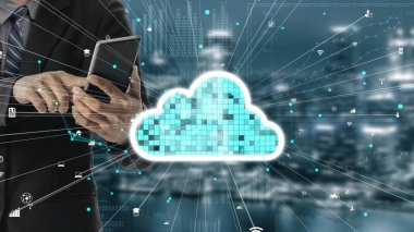 A business professional interacts with a tablet, surrounded by a cloud computing concept and digital icons, symbolizing innovation and the future of technology in a modern landscape. Xenic