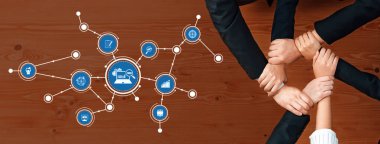 Visual representation of collaboration in business with multiple icons showcasing strategy and SEO concepts against a warm wooden background featuring diverse hands. Amity