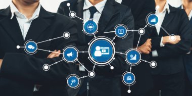 A professional business team stands confidently as they engage in discussions about digital strategies. Icons represent networking, innovation, and growth in the corporate landscape. Amity