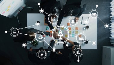 Aerial view of a business meeting showcasing teamwork and collaboration. Business icons represent innovation and strategy in a modern office setting for effective project management. Amity