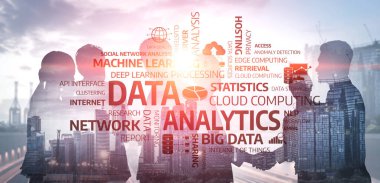 A group of professionals collaborates on data analytics strategies with an urban skyline in the background, showcasing modern technology and innovative trends. Tessel