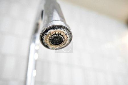 Photo for The chrome faucet is covered with lime scale - Royalty Free Image