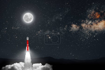 Téléchargez les photos : Une fusée vole dans l'espace la veille de Noël - en image libre de droit
