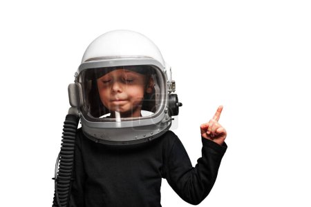 Téléchargez les photos : Un petit enfant veut piloter un avion avec un casque d'avion. - en image libre de droit