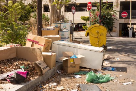 Photo for Limassol, Cyprus - October 24, 2020 - Different type of garbage and the old fridge in the city street. - Royalty Free Image